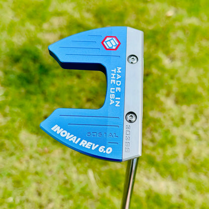 Blue golf putter head with 'Made in USA' and brand logo on a grass background